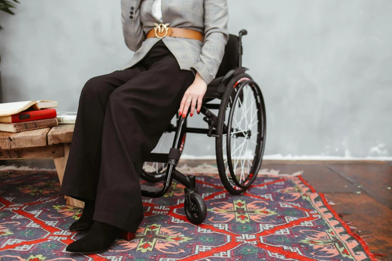 a lady sitting on a chair in a wheelchair