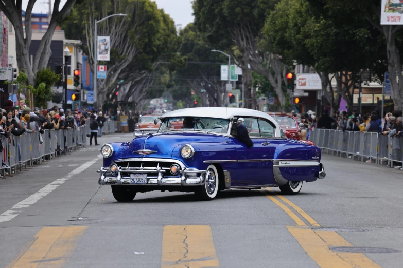 an old american car driving in the parade