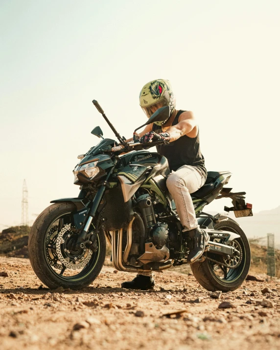 the man wearing a helmet and riding on a motorcycle