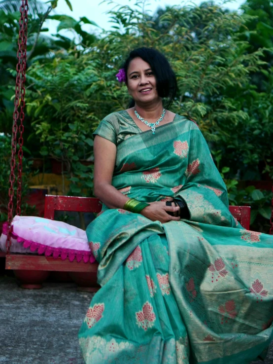 a women that is sitting down on a bench