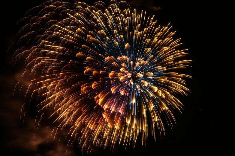 a colorful fireworks is lit up the sky