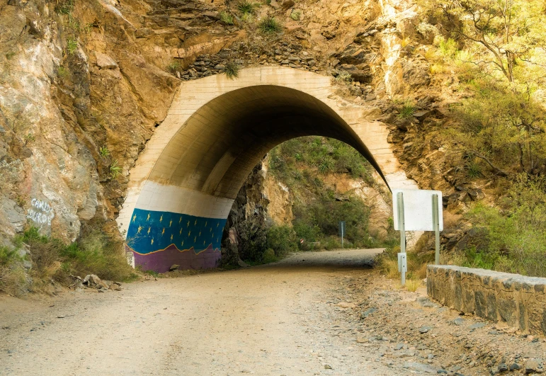 a road and tunnel on a mountain side