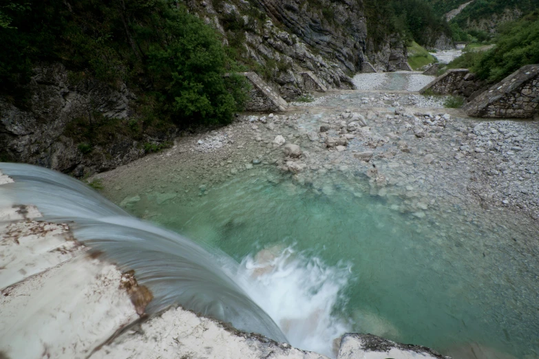 there is water that runs down the side of the mountain