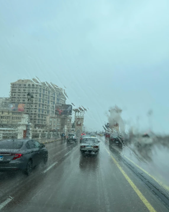 cars drive down the freeway on a rainy day