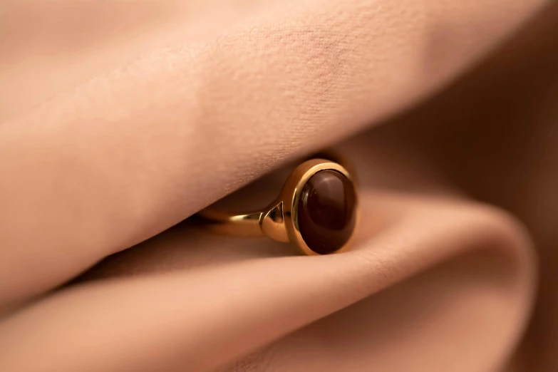 a close up of a ring with a large stone