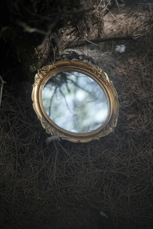 mirror with nches in front of it on the ground