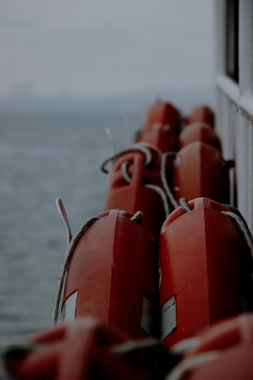 two buoys in the back of a ship with an ocean in the background