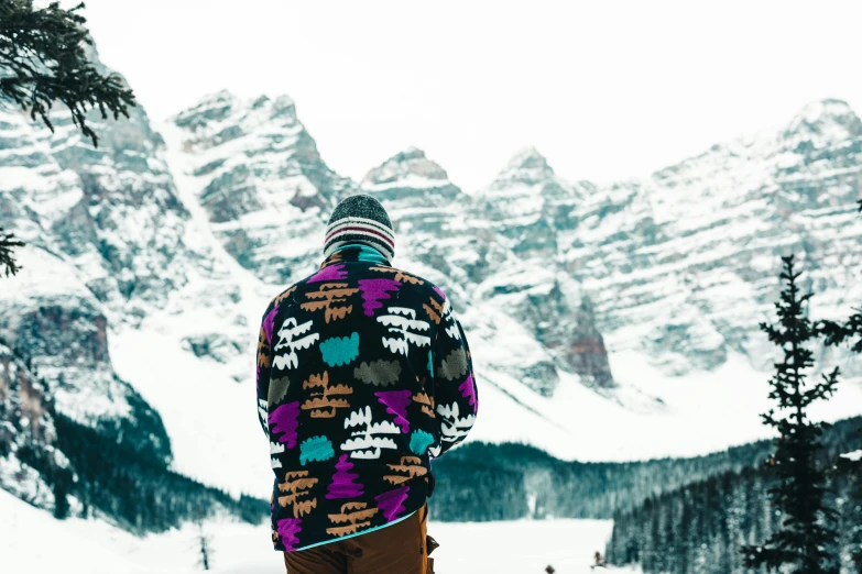 a person standing in the snow on skis