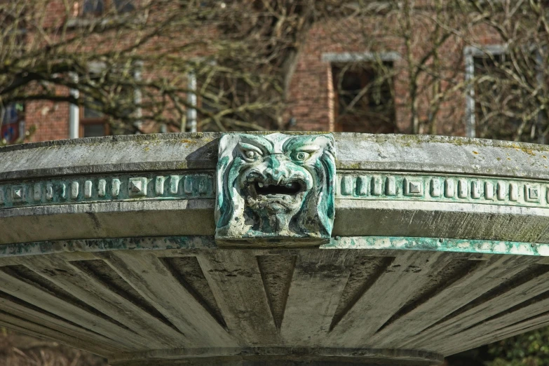 an elaborate iron statue of a gargoyle