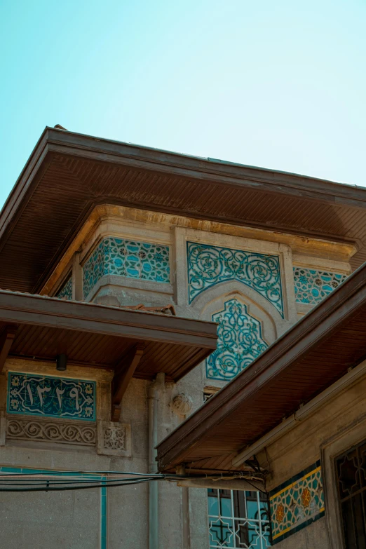 an old house with elaborate detailing painted on the wall