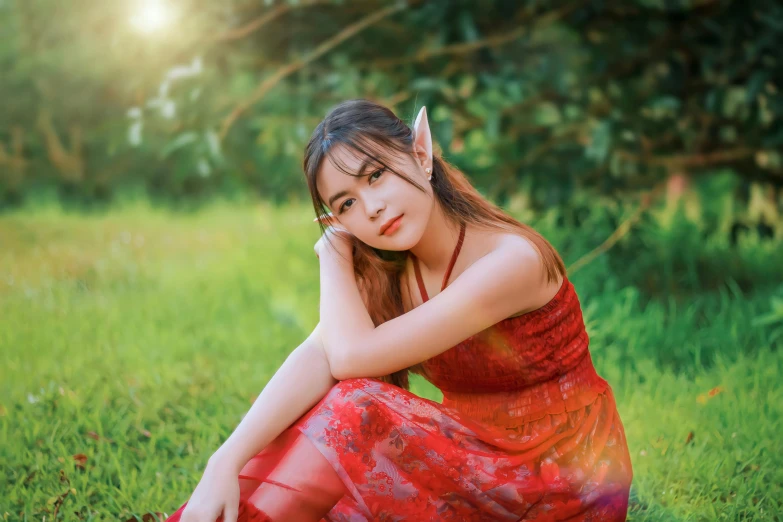 a woman with long hair in a red dress