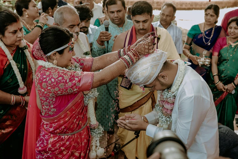 newly married couple sharing a traditional ceremony moment