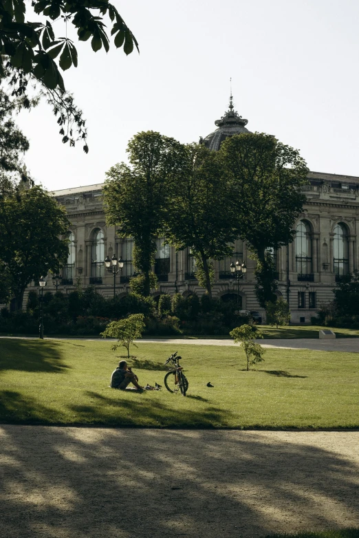 a park area in front of a large building