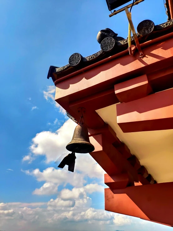 a view of a bell tower on the side of a building