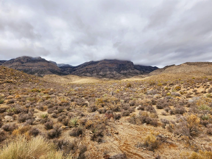 a scenic mountain range under a partly cloudy sky