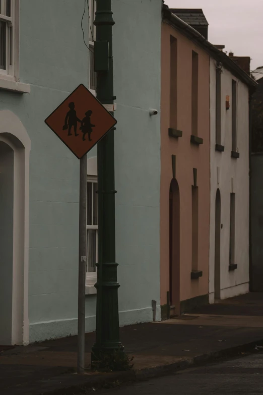 a street sign indicating a person is crossing the street