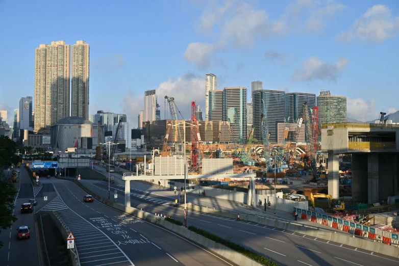 a road with lots of cars going by with skyscrs