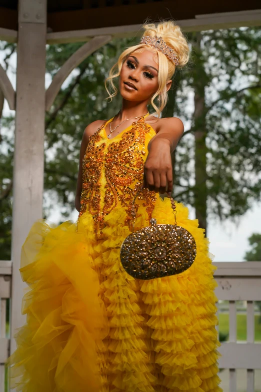 a very pretty young lady holding a purse