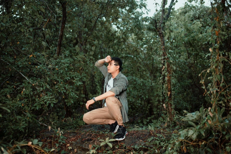 an image of a woman squatting in the woods