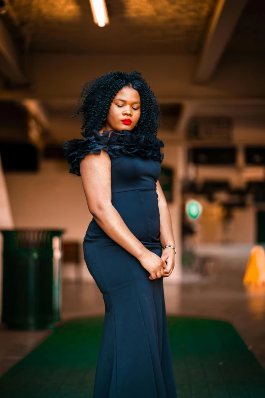 woman standing on green carpet posing for the camera