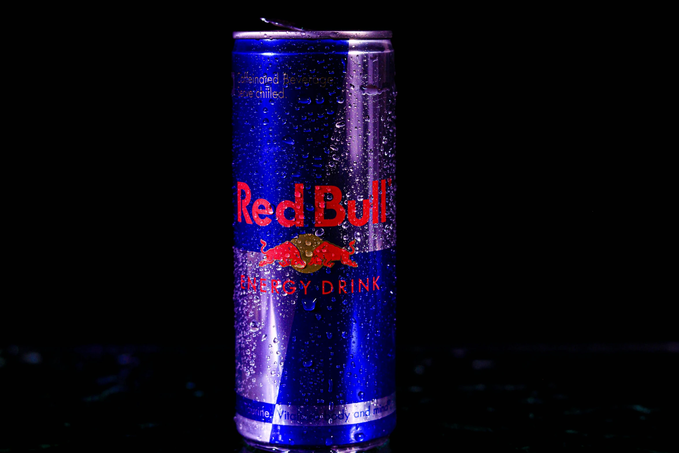 an empty can is sitting on a black background