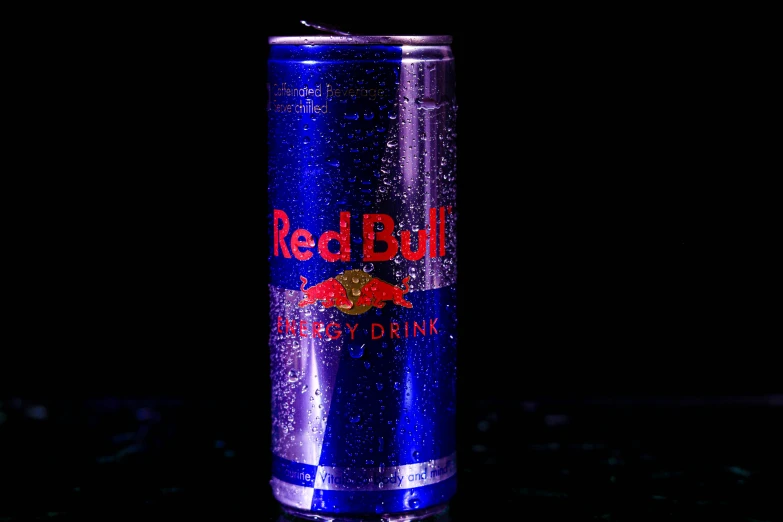 an empty can is sitting on a black background