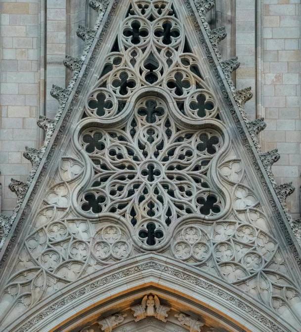 a tall building with an ornate window on the side