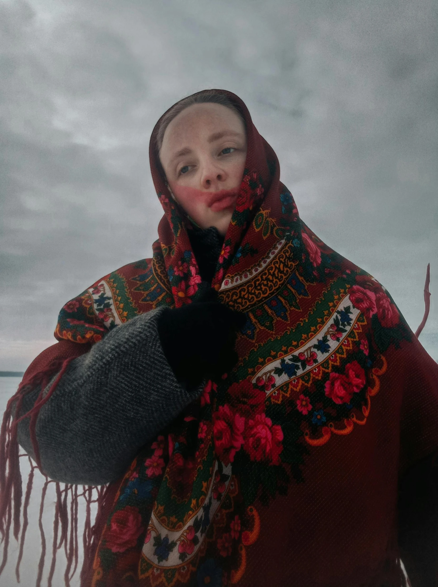 woman wearing a shawl and holding a purse