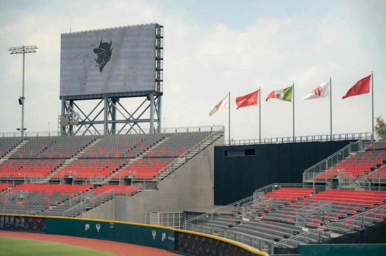 some flags and banners on some green stands