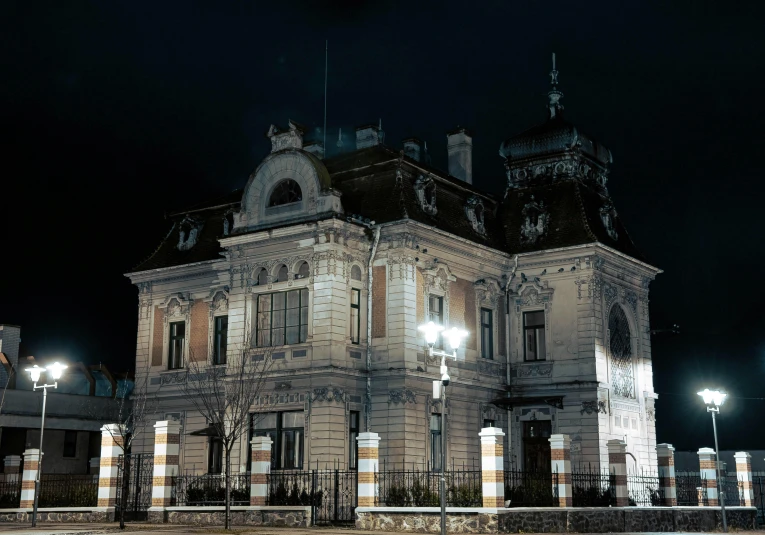 the old mansion is white and black lit up