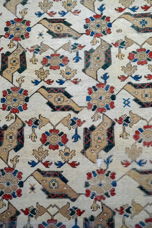 a piece of cloth with an oriental pattern on the back