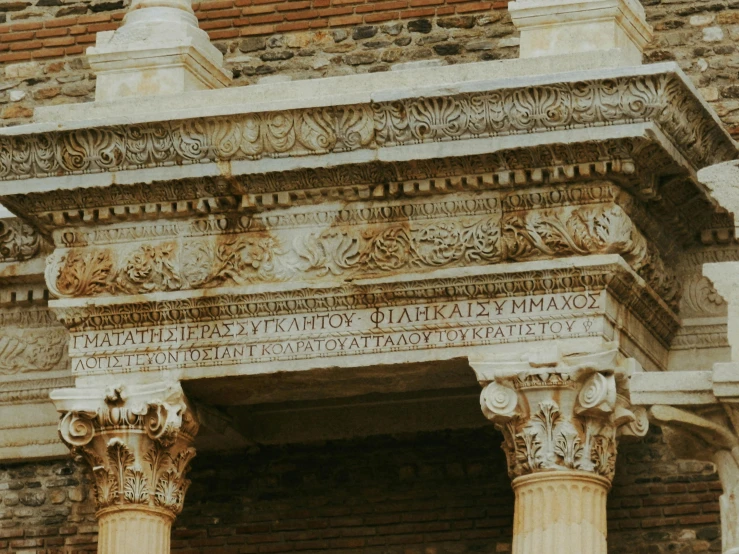 a decorative arch is in front of a brick building