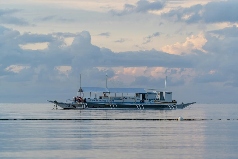 large motor boat in open open water on sunny day