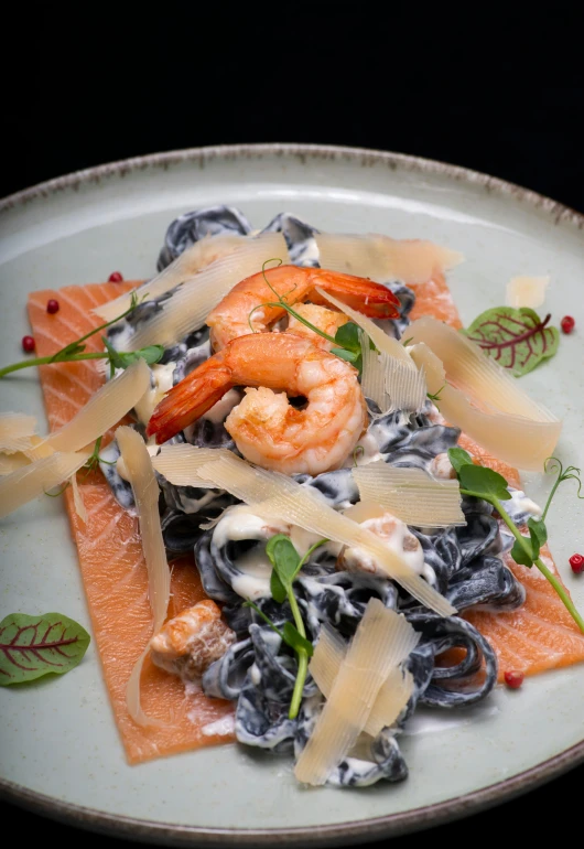 an assortment of pasta and seafood on a plate