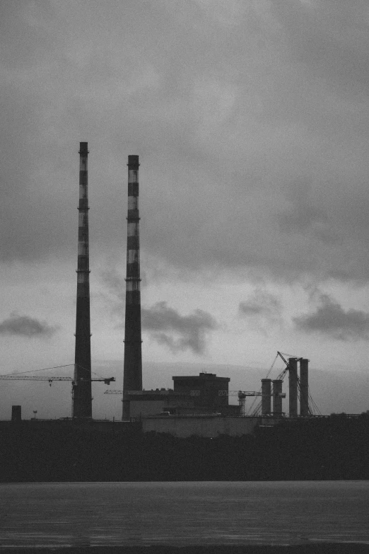 an industrial building that looks like smoke stacks