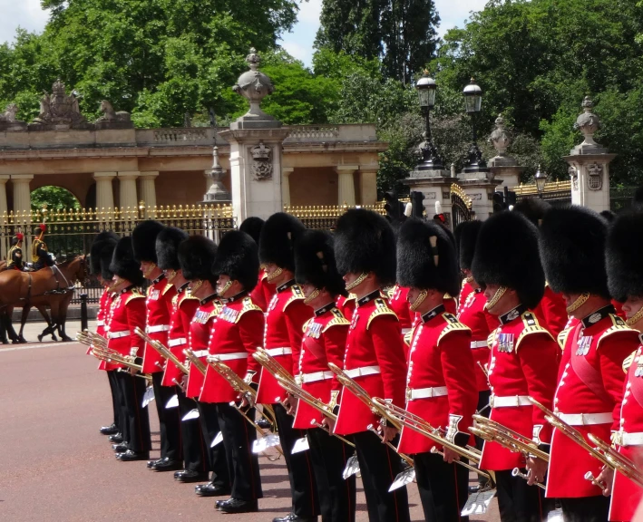 a large group of men in uniform on horses