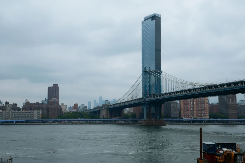 a tall tower with a metal bridge in the background