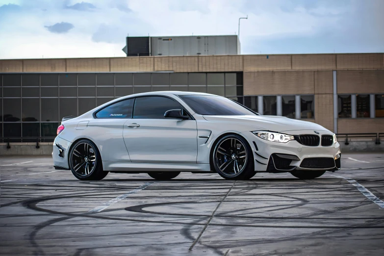the bmw bmw m4 with some glosse black wheels