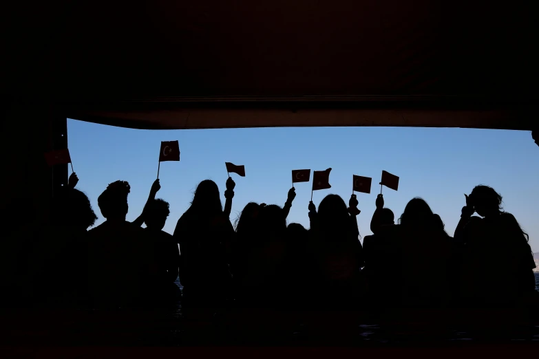 several people standing in front of a screen