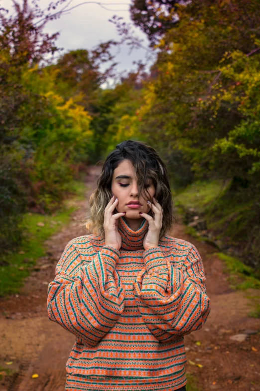 a girl with wet hair is talking on a phone