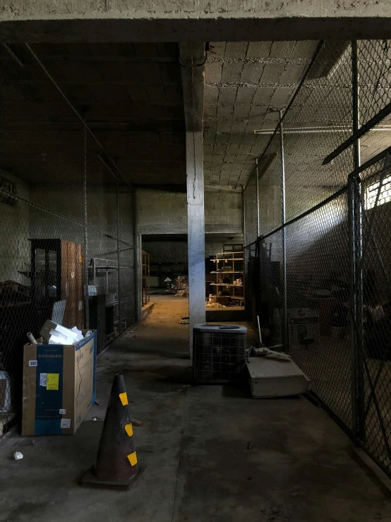 warehouse with lots of empty racks, boxes and a clock