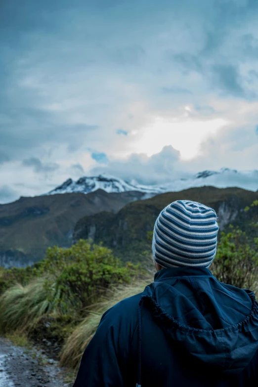 man looking at scenic mountain range in outdoor area