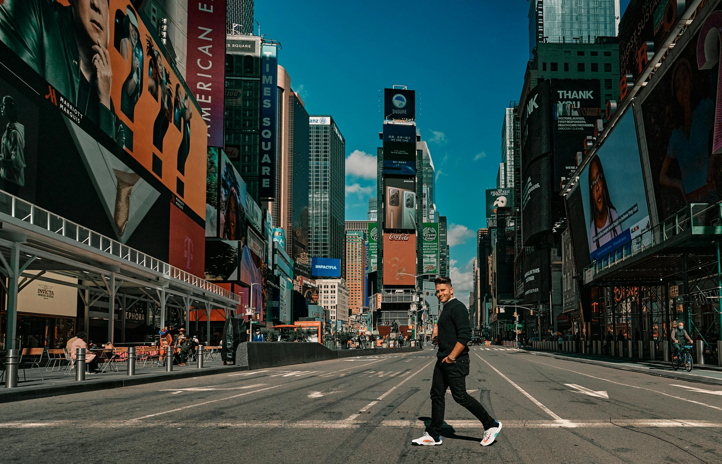 a person riding a skateboard down the middle of the road