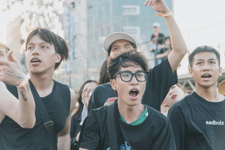 a group of young men standing next to each other