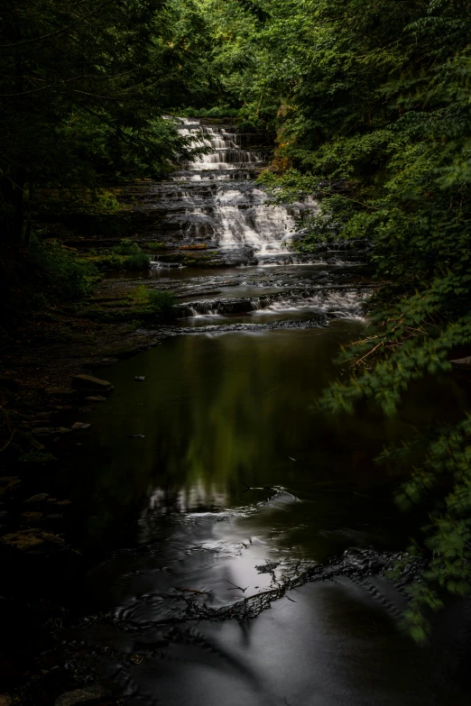 an image of a waterfall in the woods