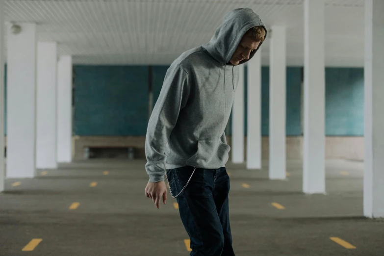 a man riding a skateboard in a parking garage