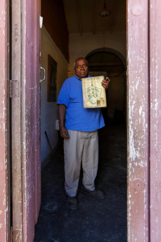 a man holding a package in his arms