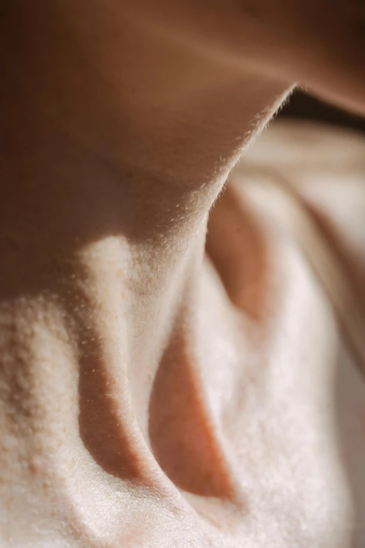 a woman's nose and shoulder with 