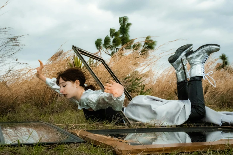 a person laying down with some frames