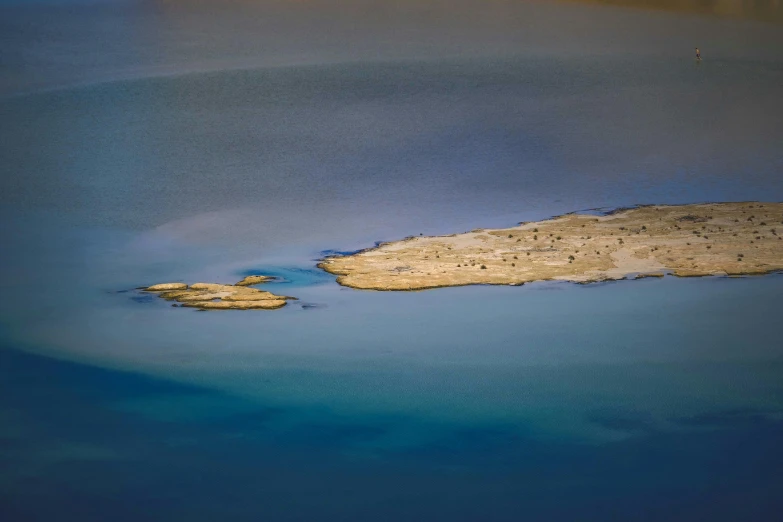 two islands of water and an island in the distance